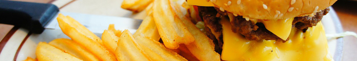 Eating Burger Fast Food at Corner Burger restaurant in Lawndale, CA.